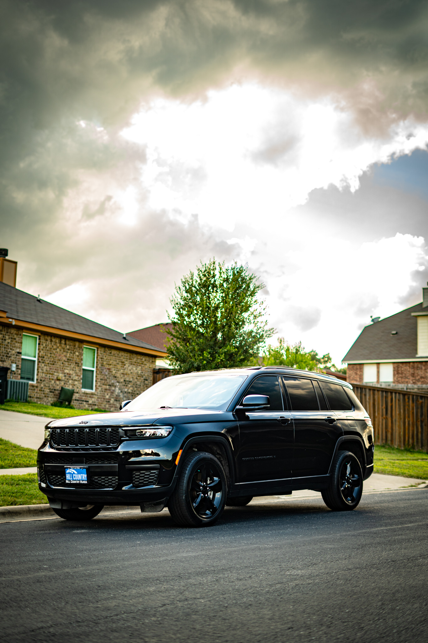 Window tint on black Jeep Grand Cherokee L — blacked-out look, Chroma Auto Lab