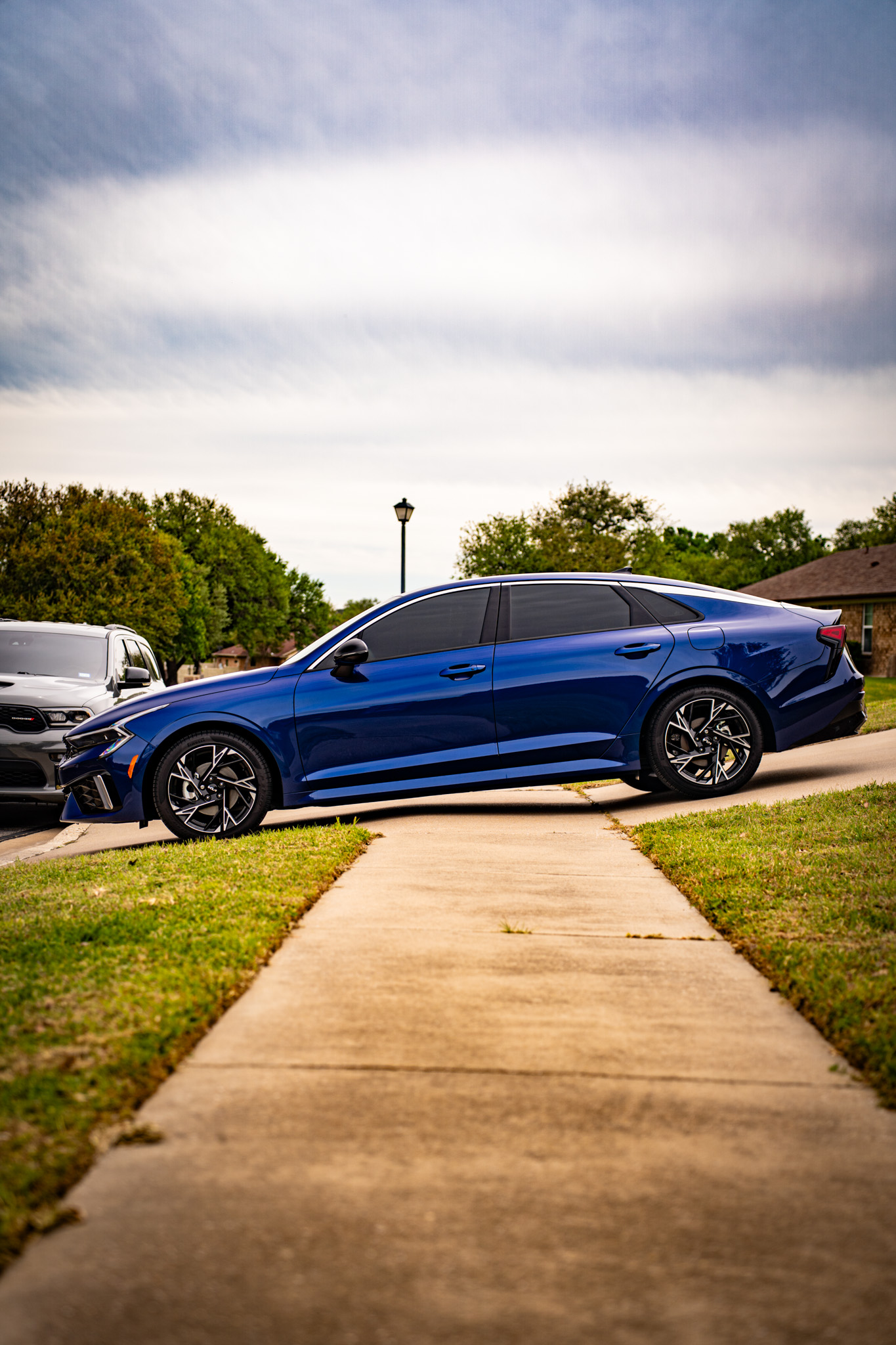 Window tint on blue Kia Stinger fastback — side profile, Killeen TX