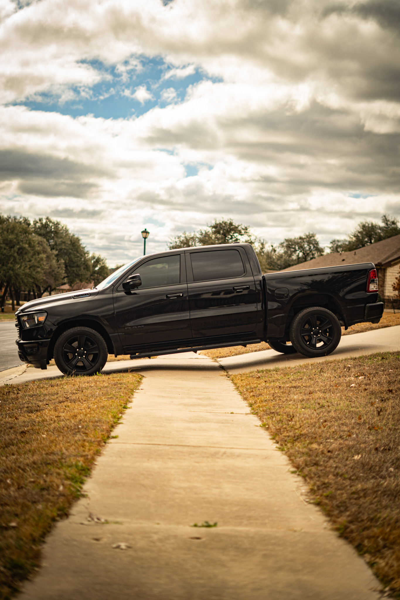 Dark window tint on black Ram 1500 truck — side profile, Chroma Auto Lab