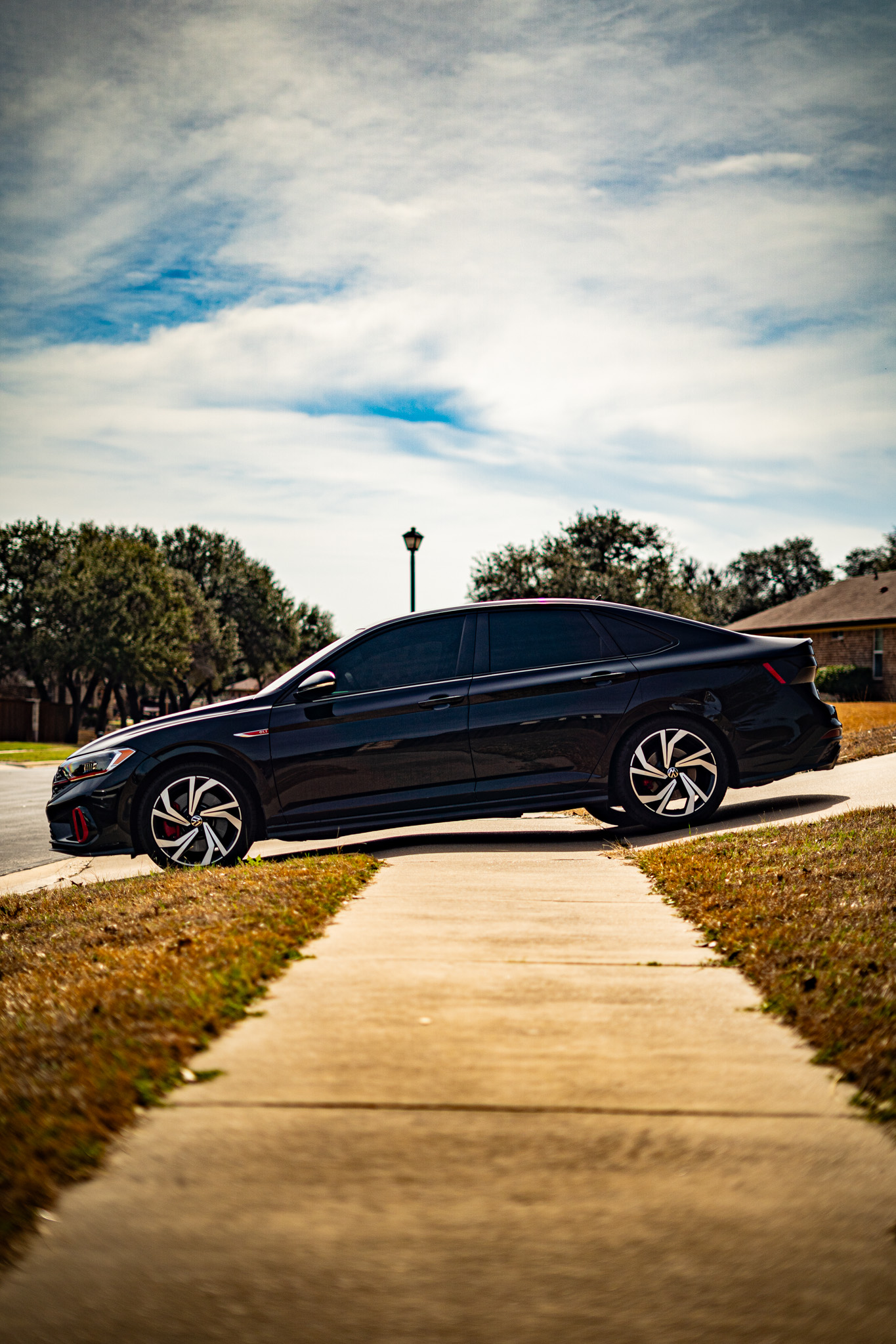 Ceramic window tint on black Volkswagen Jetta GLI — side profile, Killeen TX