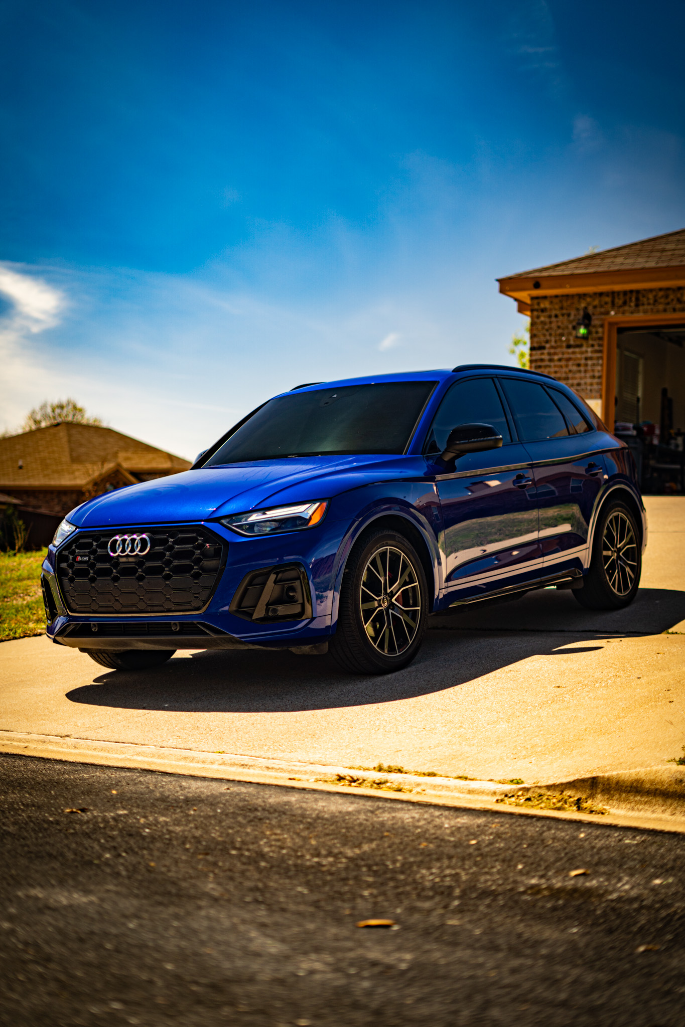 Ceramic window tint on blue Audi SQ5 — front three-quarter view, Chroma Auto Lab