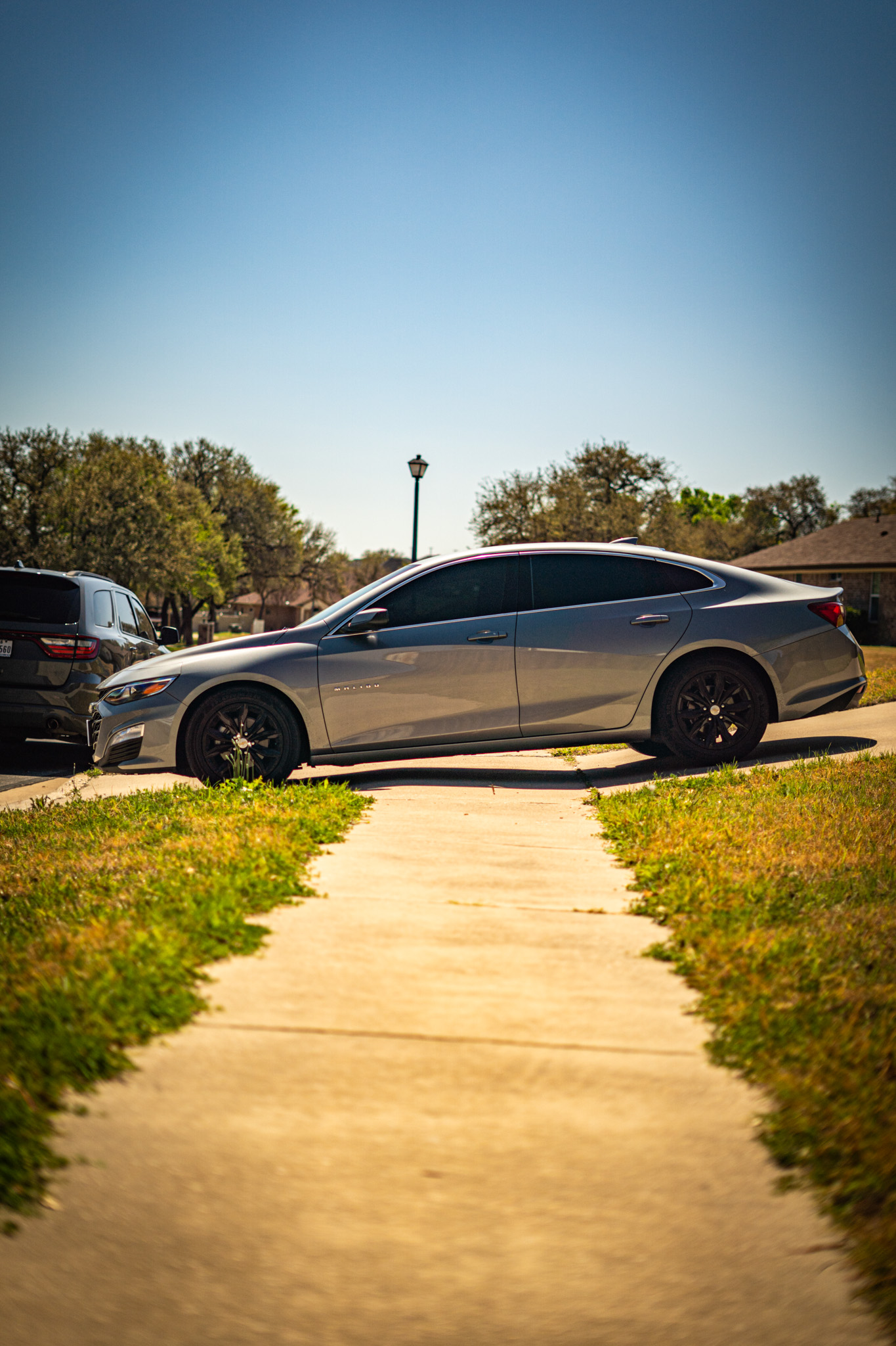 Ceramic window tint on silver Chevrolet Malibu — side profile, Chroma Auto Lab