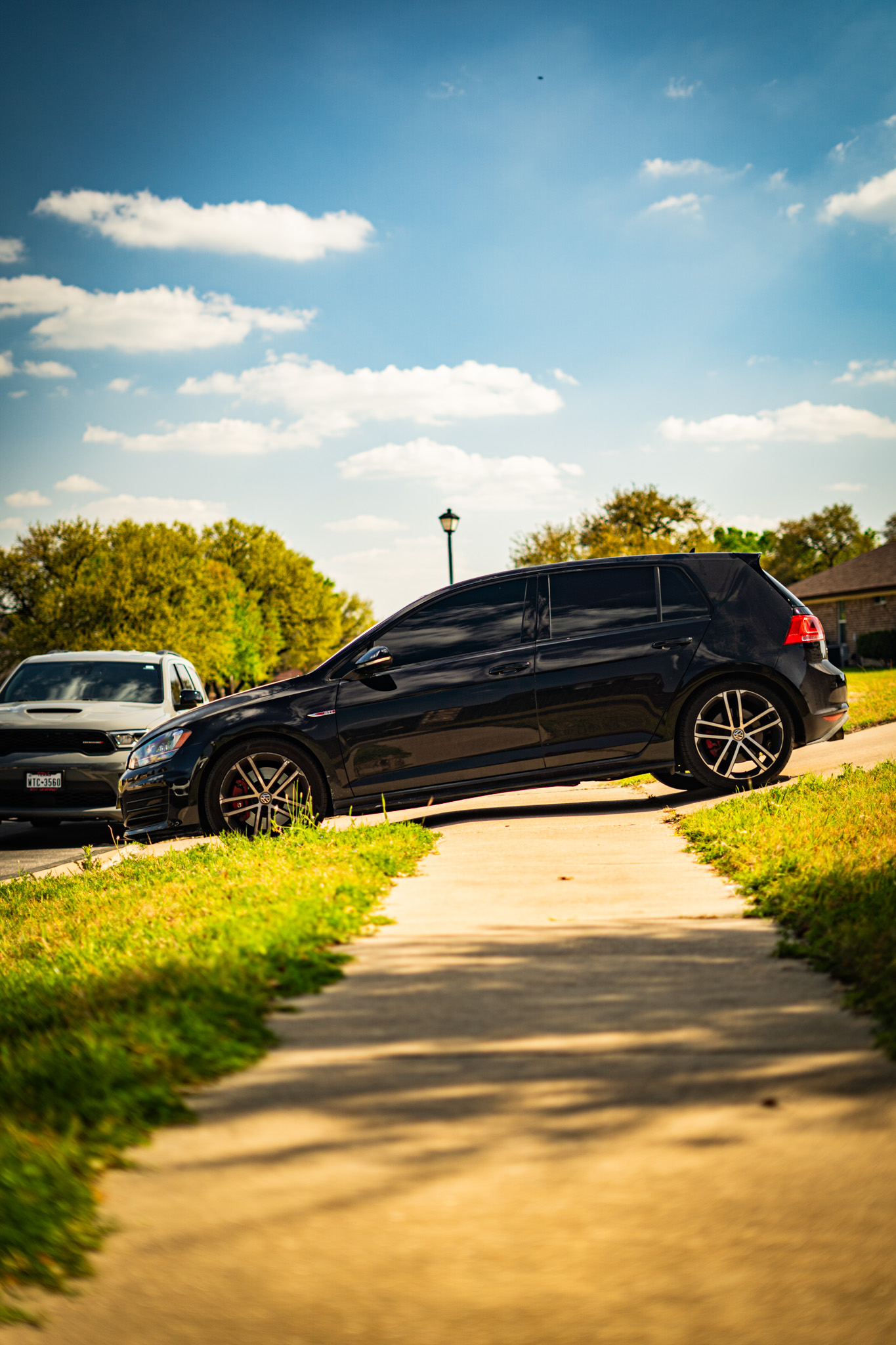 Ceramic window tint on black Volkswagen Golf GTI — side profile, Chroma Auto Lab