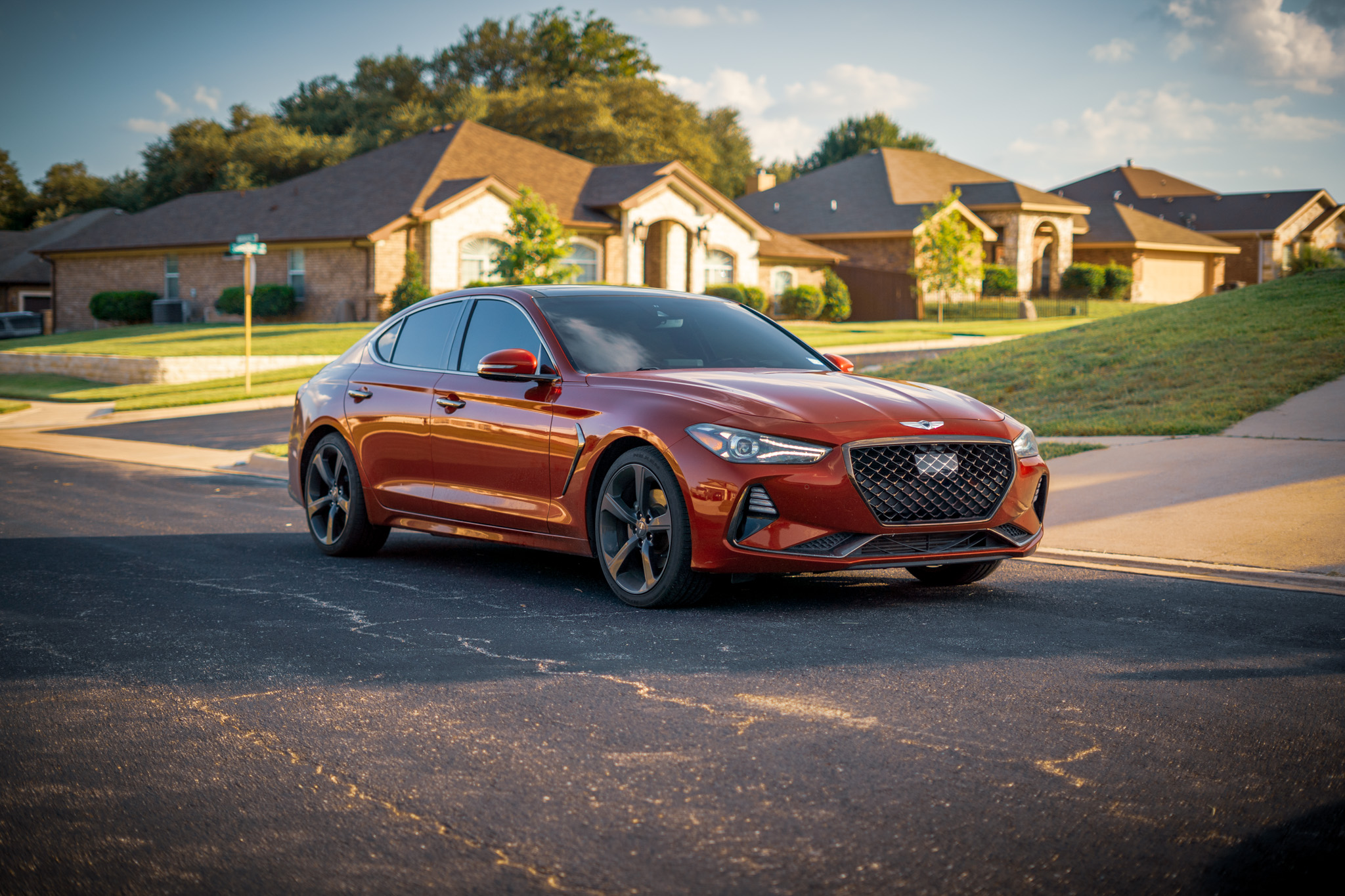 Window tint on red Genesis G70 sedan — sleek side profile, Chroma Auto Lab