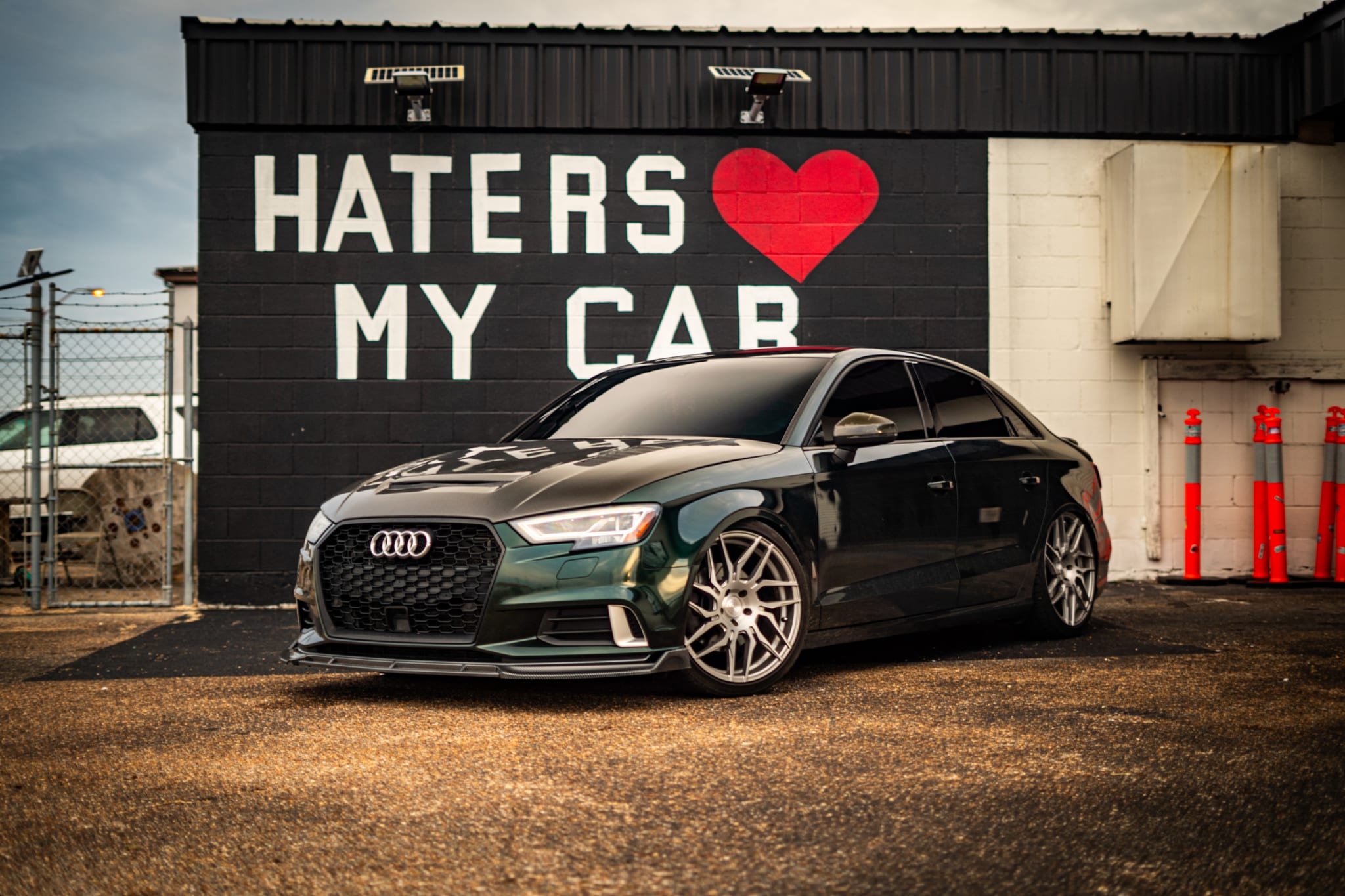 Audi A3 sedan wrapped in KPMF Gloss Green/Black Iridescent vinyl
