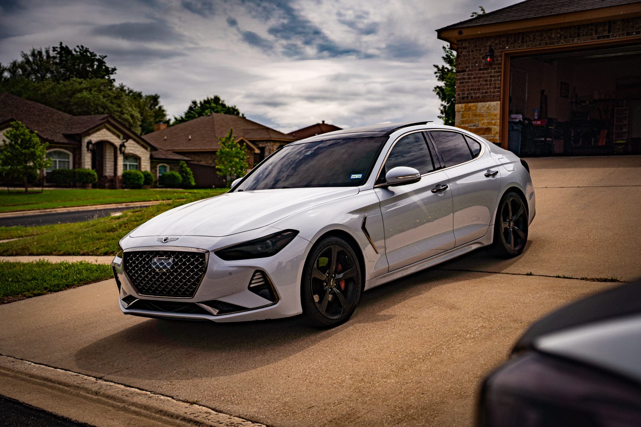 Window tint on a white Genesis G70 sedan