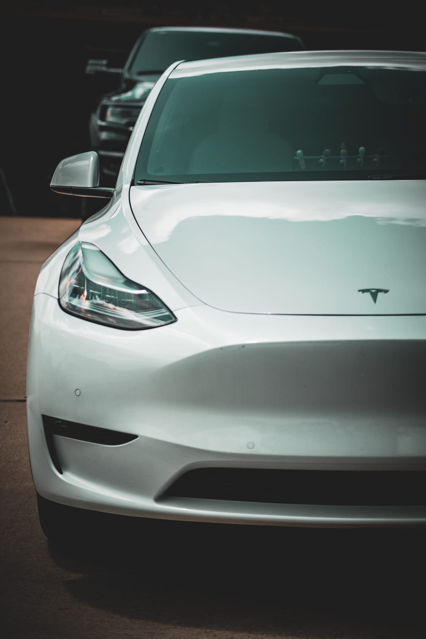 Front glass on a white Tesla Model Y after window tint